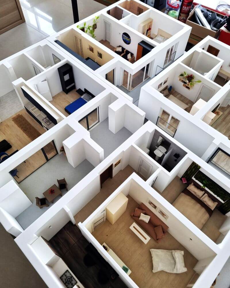 floor plan model with miniature furniture
